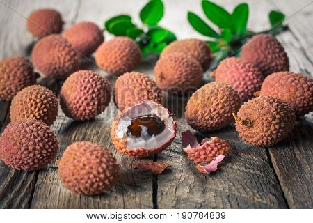 Lychees exotic fruits on a wooden background