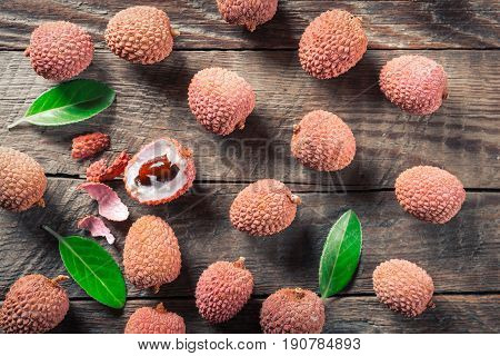 Lychees exotic fruits on a wooden background