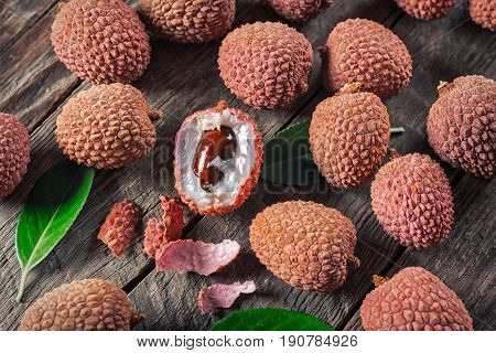 Lychees exotic fruits on a wooden background