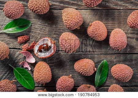 Lychees exotic fruits on a wooden background