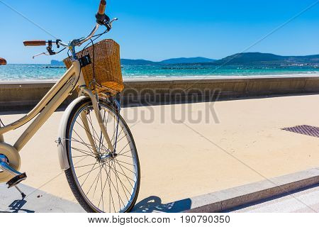 Bicycle parked by the sea in Sardinia Italy