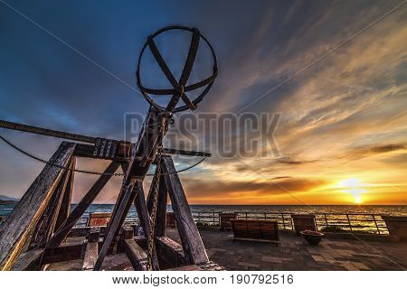 Antique catapult in Alghero seafront at sunset. Sardinia Italy