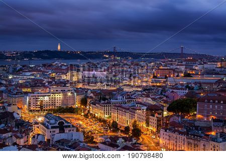 Lisbon Portugal. 05 June 2017.View of Lisbon town rooftops and tejo river from the Senhora do Monte viewpoint in Graca. Lisbon Portugal. photography by Ricardo Rocha.