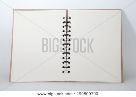 A note book that is open to make a note of it.