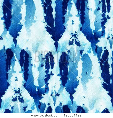 Seamless tie-dye pattern of indigo color on white silk. Hand painting fabrics - nodular batik. Shibori dyeing.