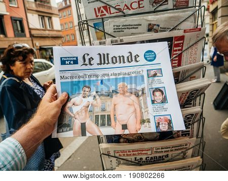 PARIS FRANCE - JUN 12 2017: Man point of view personal perspective buying at press kiosk French newspaperLe Wonde with reactions to French legislative election 2017 a day after first round