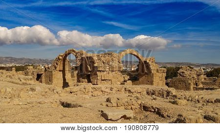 Ancient ruins of Kourion city near Pathos and Limassol, Cyprus. Santa Colones Castle ruins with blue sky. Travel outdoor background