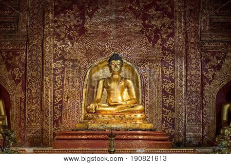 CHIANG MAI, THAILAND - FEBRUARY 6, 2016: The famous Phra Buddha Sihing at Wat Phra Singh in Chiang Mai. The construction of this temple was began in 1345.