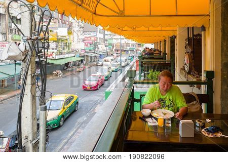 BANGKOK, THAILAND - FEBRUARY 24, 2016 : Morning breakfast at Khao San road in Bangkok. This is a world famous backpacker street and a major tourist attraction in Thailand.