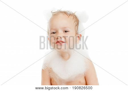 Funny little child in a bubble bath with soap foam isolared white bsckgtound