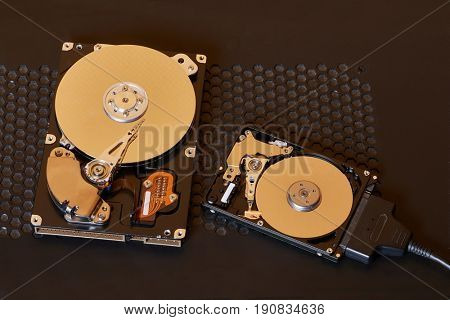 A 3.5 inch desktop and a 2.5 inch laptop hard disk side by side