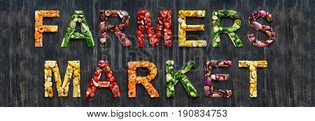 Farmers market word from overhead flatlay  colourful multi-colored fruits and vegetables veggies fresh produce organic harvest