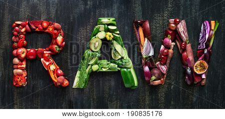 The word raw overhead flatlay word in colourful multi color fruits and vegetables veggies