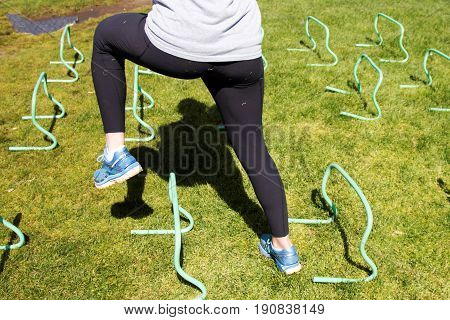 An athlete runs sidways working different plains of the body at practice