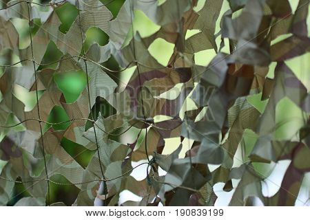 the military camouflage net green green background