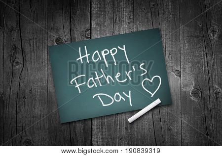 Happy fathers day sign on wooden boards background