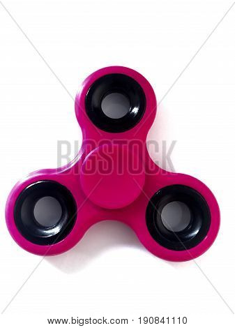 purple fidget spinner stress relieving toy on white background