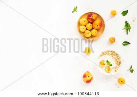 Fresh Summer Fruit. Healthy Breakfast With Peach, Nectarine, Apricot, Muesli, Peach Yogurt, Mint, Ce