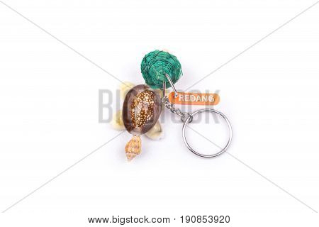 Redang Island key chain souvenir on a white background.