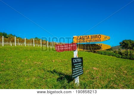 AUCKLAND, NEW ZEALAND- MAY 12, 2017: New Zealand wooden sign with winery background.