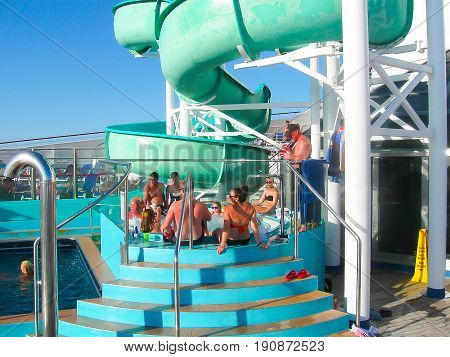 Miami, United States of America - January 12, 2014: The people resting at jacuzzi at Carnival Glory Cruise Ship, the ship leaving Miami, USA on January 12, 2014. Carnival Glory is a Conquest-class cruise ship built in 2003 with capacity of 2974 passengers