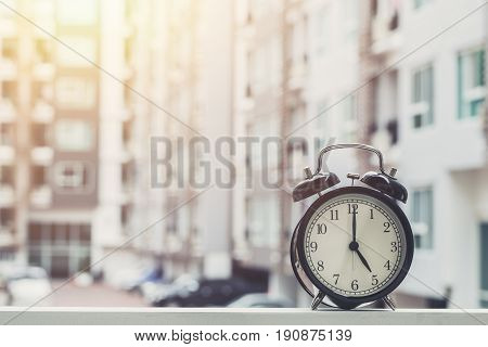 5 O'clock Retro Clock With The Clock Condominium Background.