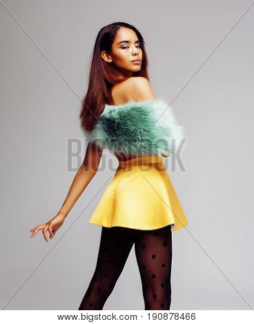 young pretty african-american woman posing in fashion clothers emotional, lifestyle people concept close up