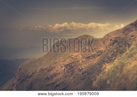 Mountain grass and blue skytop of green hill