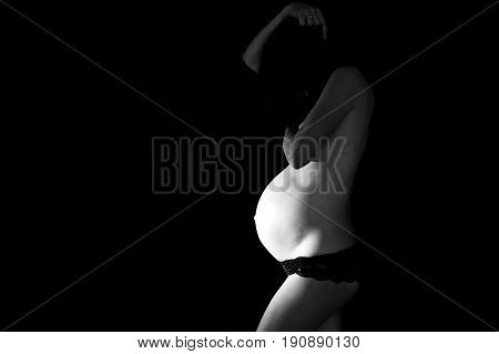 Portrait Of Beautiful Pregnant Woman, Isolated On Black Studio Background