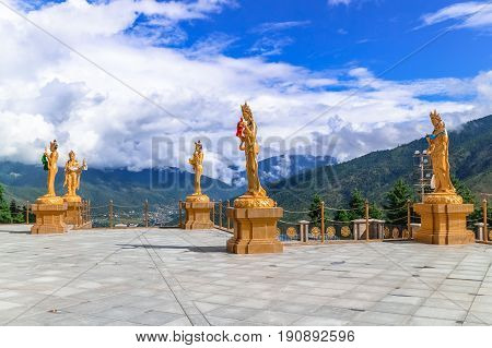 Golden statues of Buddhist female gods at Buddha Dordenma temple Thimphu Bhutan South Asia