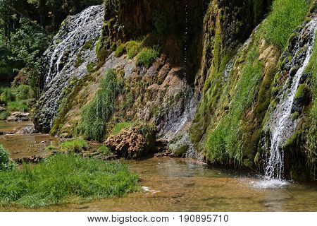 Waterfalls and river rocks in Baume-Les-Messieurs valley