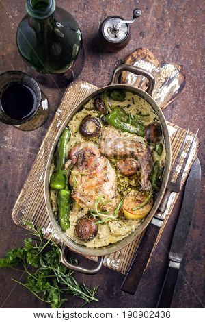 Rabbit with Vegetable and Mushrooms in White Wine Cream Sauce as top view in a Stewpot 