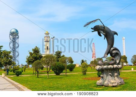 Batumi, Georgia - May 2, 2017: City panoramic landscape with Chacha tower, ferris wheel and dolphin statue in Batumi, Georgia summer Black sea resort