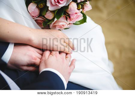 Gentle Hand of the Bride in the Bridegroom's Hand