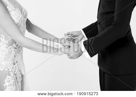 ballrom dance couple in love holding hands isolated on white bachground. sensual professional dancers dancing walz tango slowfox and quickstep black and white