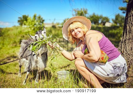 Funny picture a beautiful young girl farmer with in Hat