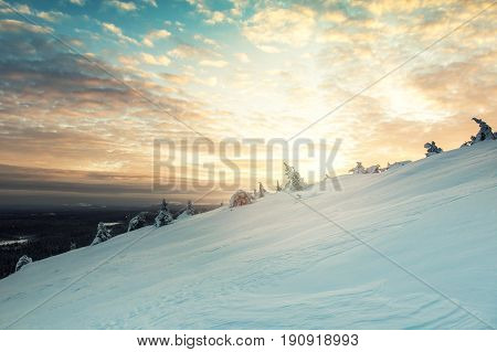 beautiful winter sunset landscape in Luosto Finland
