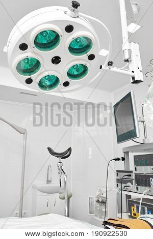 Vertical shot of a gynecological operating theatre with medical equipment and surgical lamp living vitality medicine clinical hospital ward health surgery concept.