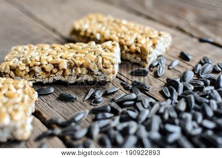 Kozinak from sunflower seeds on wooden background