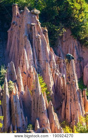  Magnificent Dolomites in Tyrol. Renon's earth pillars at sunrise. Journey to  magical fairy-tale country. The concept of ecological tourism 