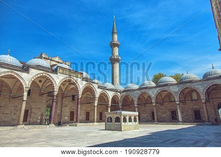 Cortyard of Suleymaniye Mosque with arches in Istanbul Turkey. The mosque was constructed by Sinan for sultan Suleyman the Magnificent