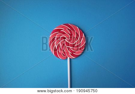 Lollipop on a stick on a bright background