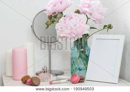 Bouquet Of Pink Peonies In A Vase. Bouquet Of Peonies In A Vase, Macaroon, Cosmetics On The Table. D