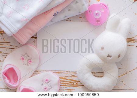Baby shower concept - child essencials on wood background, copy space