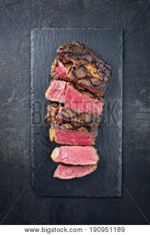Barbecue Wagyu Entrecote sliced as close-up on a slate