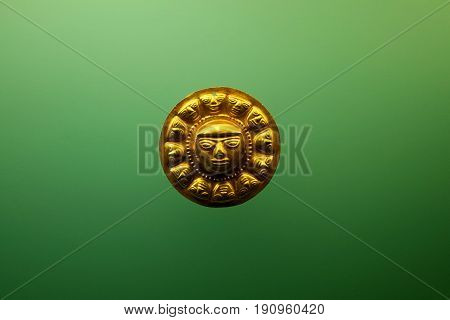 Pre Columbian indigenous golden face from Colombia