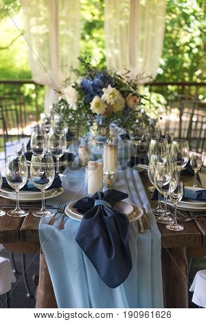Empty wine glasses on the background of the decorated table. Wedding subjects. Registration Wedding dinner.