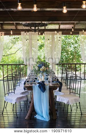 Empty wine glasses on the background of the decorated table. Wedding subjects. Registration Wedding dinner.