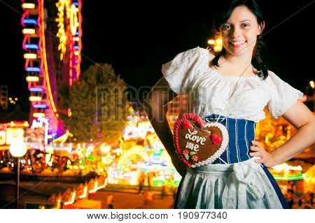a young woman at the cannstatter wasen in stuttgart, an event very similar to the better-known 'oktoberfest' in munich.