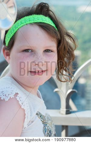 View of a Beautiful young girl on observation deck overlooking the lower Manhattan New York City skyline